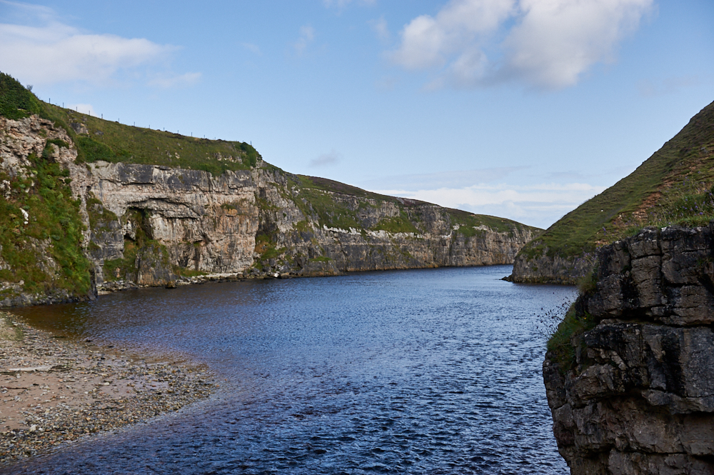 Smoo Cave, a large seawater and freshwater cave on the North Coast of Scotland.