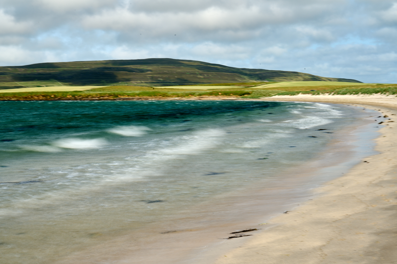 Walking along the sands of Evie in Orkney.